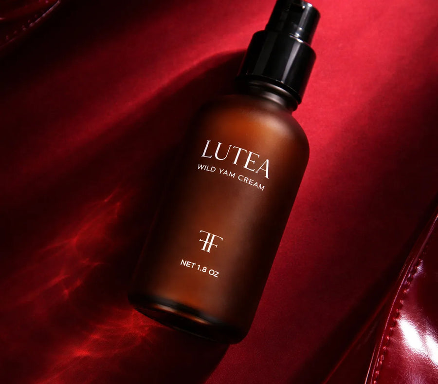 LUTÉA on deep red satin